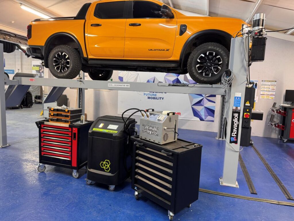 Vehicle on a workshop lift at RMT's IMI Approved Training Centre in Oswestry awaiting an automatic transmission fluid (ATF) service demonstration.