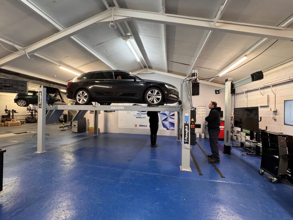 MOT Training candidate carrying out a practical vehicle inspection on a 4-post lift at RMT's IMI Approved Training Centre in Oswestry.