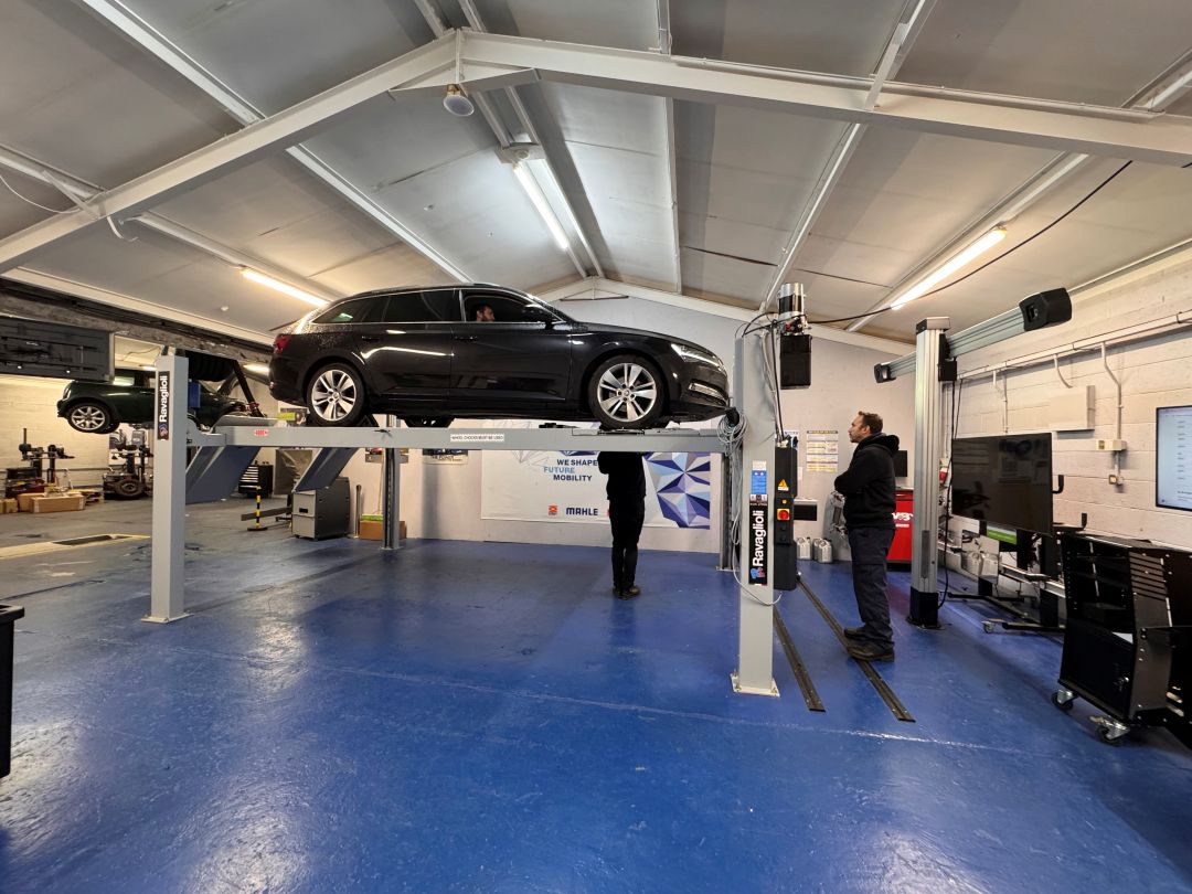Light Vehicle Inspection Technician candidate inspecting a vehicle on a 4-post lift during practical training at RMT Automotive Services